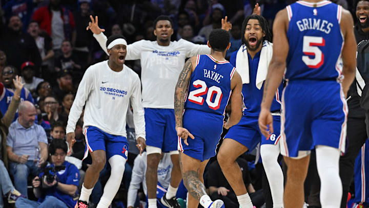 Mar 10, 2026; Philadelphia, Pennsylvania, USA; Philadelphia 76ers guard Cameron Payne (20) celebrates a three point basket with guard Vj Edgecombe (77) and forward Trendon Watford (12) against the Memphis Grizzlies during the second half at Xfinity Mobile Arena. Mandatory Credit: Eric Hartline-Imagn Images