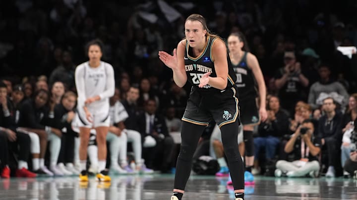 Sep 29, 2024; Brooklyn, New York, USA; New York Liberty guard Sabrina Ionescu (20) reacts to a play against the Las Vegas Aces during game one of the 2024 WNBA Semi-finals at Barclays Center. Mandatory Credit: Gregory Fisher-Imagn Images