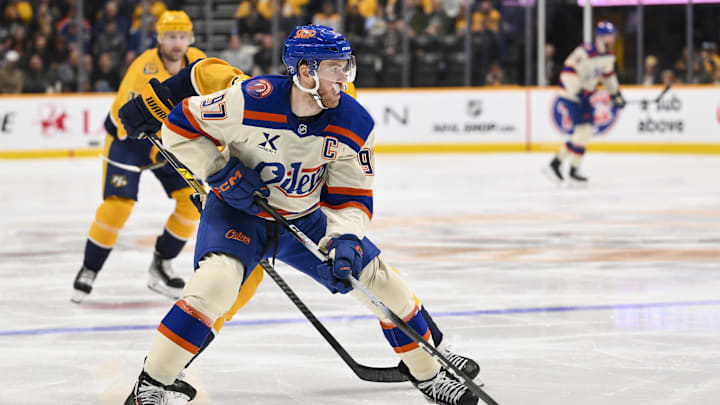 Jan 13, 2026; Nashville, Tennessee, USA;  Edmonton Oilers center Connor McDavid (97) skates with the puck against the Nashville Predators during the second period at Bridgestone Arena. Mandatory Credit: Steve Roberts-Imagn Images
