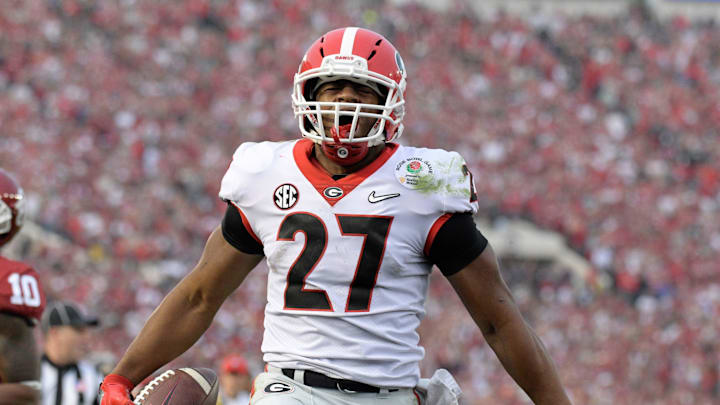 Jan 1, 2018; Pasadena, CA, USA; Georgia Bulldogs running back Nick Chubb (27) celebrates after scoring on a 50-yard touchdown run in the third quarter against the Oklahoma Sooners in the 2018 Rose Bowl college football playoff semifinal game at Rose Bowl Stadium. Georgia defeated Oklahoma 54-48 in two overtimes. Mandatory Credit: Kirby Lee-Imagn Images Jan 1, 2018; Pasadena, CA, USA; Georgia Bulldogs running back Nick Chubb (27) celebrates after scoring on a 50-yard touchdown run in the third quarter against the Oklahoma Sooners in the 2018 Rose Bowl college football playoff semifinal game at Rose Bowl Stadium. Georgia defeated Oklahoma 54-48 in two overtimes. Mandatory Credit: Kirby Lee-Imagn Images