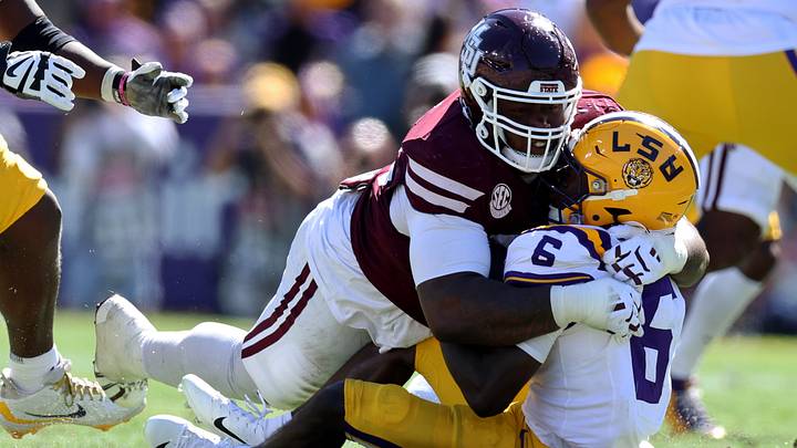 Oct 17, 2026; Baton Rouge, Louisiana, USA;  Mississippi State Bulldogs defensive line Kalvin Dinkins (35) takes down 
Louisiana State Tigers wide receiver Winston Watkins (6) during the second half at Tiger Stadium.  Mandatory Credit: Stephen Lew-Imagn Images