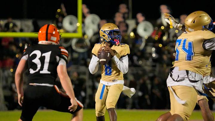 Mainland quarterback PJ Miller (8) looks for an open receiver down the field against Spruce Creek on Oct. 9, 2026. Last week, he accounted for five TDs in a 52-35 victory against Lake Mary. 