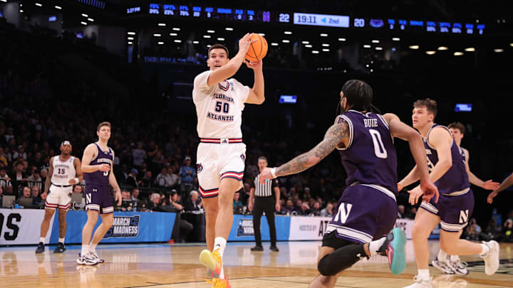 March 22, 2024, Brooklyn, NY, USA; Florida Atlantic Owls center Vladislav Goldin (50) drives to the