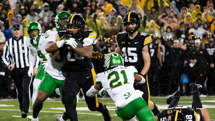 Iowa Hawkeyes running back Kamari Moulton (28) carries the ball Nov. 8, 2025 during a Big Ten Football game against the Oregon Ducks at Kinnick Stadium in Iowa City, Iowa. Iowa Hawkeyes running back Kamari Moulton (28) carries the ball Nov. 8, 2025 during a Big Ten Football game against the Oregon Ducks at Kinnick Stadium in Iowa City, Iowa.
