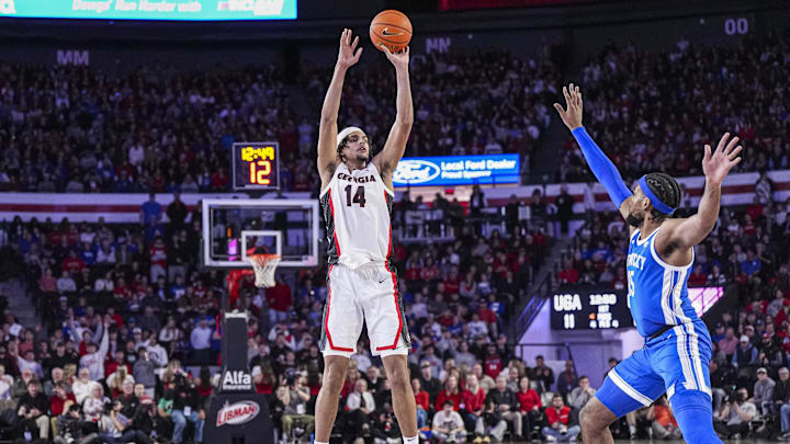 Jan 7, 2025; Athens, Georgia, USA; Georgia Bulldogs forward Asa Newell (14) shoots over Kentucky Wildcats forward Ansley Almonor (15) during the first half at Stegeman Coliseum. Mandatory Credit: Dale Zanine-Imagn Images
