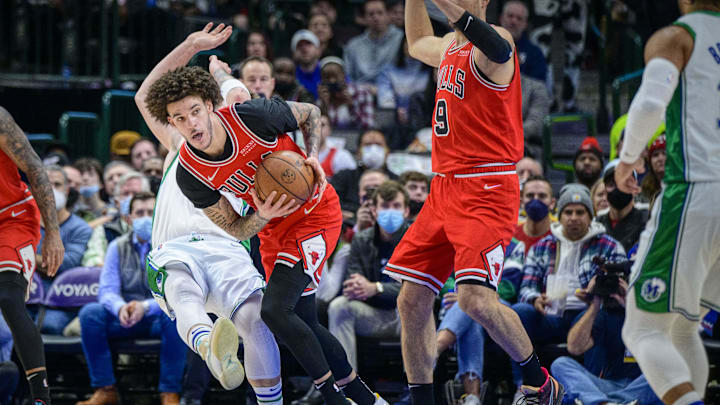 Jan 9, 2022; Dallas, Texas, USA; Chicago Bulls guard Lonzo Ball (2) steals the ball from Dallas Mavericks guard Luka Doncic (77) during the first quarter at the American Airlines Center. Mandatory Credit: Jerome Miron-Imagn Images