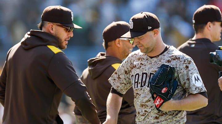 San Diego Padres starting pitcher Michael King (34) celebrates with San Diego Padres Joe Musgrove (44) after throwing a complete-game two hit shutout against the Colorado Rockies at Petco Park on April 13. San Diego Padres starting pitcher Michael King (34) celebrates with San Diego Padres Joe Musgrove (44) after throwing a complete-game two hit shutout against the Colorado Rockies at Petco Park on April 13.