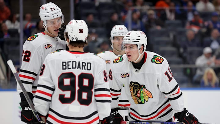 Mar 24, 2026; Elmont, New York, USA; Chicago Blackhawks center Anton Frondell (15) talks to center Connor Bedard (98) and defenseman Alex Vlasic (72) during the third period at UBS Arena. Mandatory Credit: Brad Penner-Imagn Images