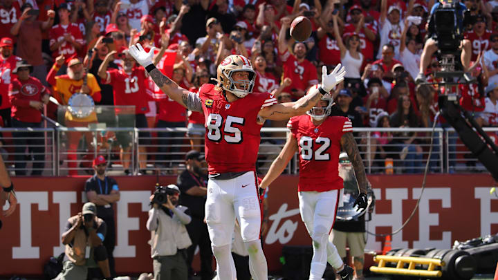 Oct 6, 2024; Santa Clara, California, USA; San Francisco 49ers tight end George Kittle (85) celebrates after scoring a touchdown against the Arizona Cardinals during the first quarter at Levi's Stadium. Mandatory Credit: Kelley L Cox-Imagn Images Oct 6, 2024; Santa Clara, California, USA; San Francisco 49ers tight end George Kittle (85) celebrates after scoring a touchdown against the Arizona Cardinals during the first quarter at Levi's Stadium. Mandatory Credit: Kelley L Cox-Imagn Images