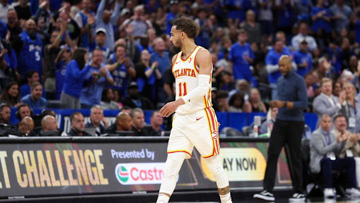 Apr 15, 2025; Orlando, Florida, USA; Atlanta Hawks guard Trae Young (11) reacts after given a technical foul against the Orlando Magic in the fourth quarter at Kia Center. Mandatory Credit: Nathan Ray Seebeck-Imagn Images