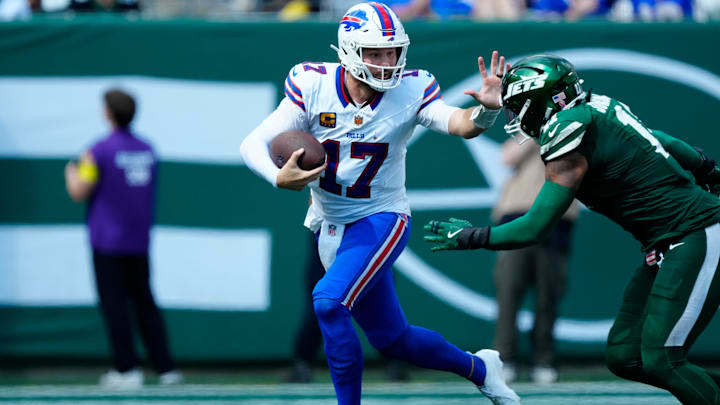 Buffalo Bills quarterback Josh Allen (17) tries to prevent New York Jets linebacker Jermaine Johnson (11) from tackling him, Sunday, September 14, 2025, in East Rutherford. Buffalo Bills quarterback Josh Allen (17) tries to prevent New York Jets linebacker Jermaine Johnson (11) from tackling him, Sunday, September 14, 2025, in East Rutherford.