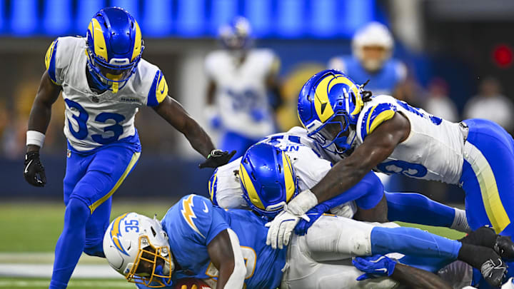 Aug 16, 2025; Inglewood, California, USA; Los Angeles Chargers running back Raheim Sanders (35) is tackled against the Los Angeles Rams during the fourth quarter at SoFi Stadium. Mandatory Credit: Jonathan Hui-Imagn Images Aug 16, 2025; Inglewood, California, USA; Los Angeles Chargers running back Raheim Sanders (35) is tackled against the Los Angeles Rams during the fourth quarter at SoFi Stadium. Mandatory Credit: Jonathan Hui-Imagn Images