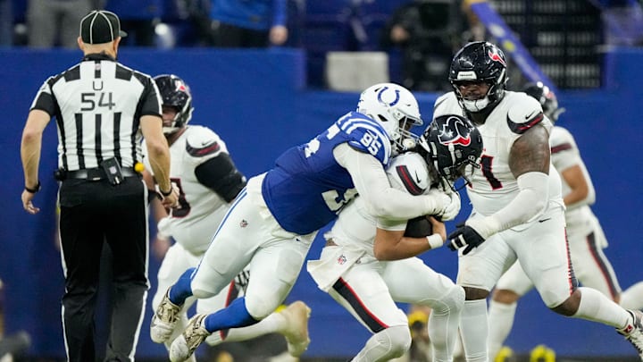 Indianapolis Colts defensive tackle Adetomiwa Adebawore (95) sacks Houston Texans quarterback C.J. Stroud (7) on Sunday, Nov. 30, 2025, during a game at Lucas Oil Stadium in Indianapolis.