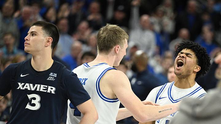 Jan 21, 2026; Omaha, Nebraska, USA;  Creighton Bluejays guard Austin Swartz (1) celebrates with guard Josh Dix (4) after scoring the winning basket as Xavier Musketeers guard All Wright (3) looks on during the second half at CHI Health Center Omaha. Mandatory Credit: Steven Branscombe-Imagn Images