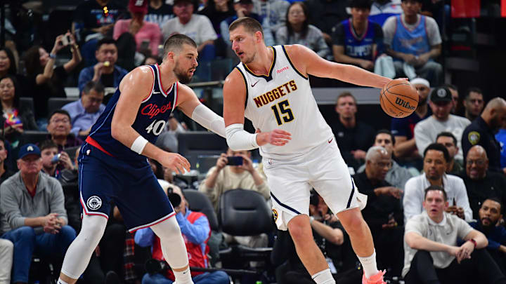 Apr 24, 2025; Inglewood, California, USA; Denver Nuggets center Nikola Jokic (15) controls the ball against Los Angeles Clippers center Ivica Zubac (40) during the second half of game three in the first round for the 2024 NBA Playoffs at Intuit Dome. Mandatory Credit: Gary A. Vasquez-Imagn Images Apr 24, 2025; Inglewood, California, USA; Denver Nuggets center Nikola Jokic (15) controls the ball against Los Angeles Clippers center Ivica Zubac (40) during the second half of game three in the first round for the 2024 NBA Playoffs at Intuit Dome. Mandatory Credit: Gary A. Vasquez-Imagn Images