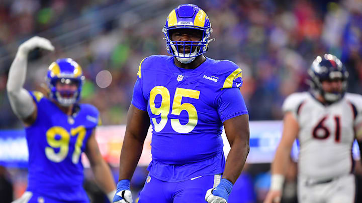 Dec 25, 2022; Inglewood, California, USA; Los Angeles Rams defensive tackle Bobby Brown III (95) reacts after a defensive play against the Denver Broncos during the second half at SoFi Stadium. Mandatory Credit: Gary A. Vasquez-Imagn Images