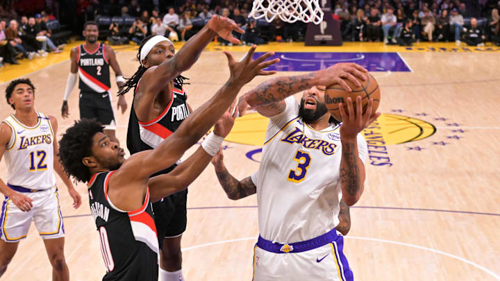 Dec 8, 2024; Los Angeles, California, USA; Portland Trail Blazers guard Scoot Henderson (00) and forward Jerami Grant (9) defend a rebound by Los Angeles Lakers forward Anthony Davis (3) in the first half at Crypto.com Arena. Mandatory Credit: Jayne Kamin-Oncea-Imagn Images Dec 8, 2024; Los Angeles, California, USA; Portland Trail Blazers guard Scoot Henderson (00) and forward Jerami Grant (9) defend a rebound by Los Angeles Lakers forward Anthony Davis (3) in the first half at Crypto.com Arena. Mandatory Credit: Jayne Kamin-Oncea-Imagn Images