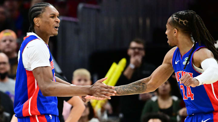 Jan 4, 2026; Cleveland, Ohio, USA; Detroit Pistons guard Ausar Thompson (9) and guard Daniss Jenkins (24) celebrate after a basket against the Cleveland Cavaliers during the second half at Rocket Arena. Mandatory Credit: Ken Blaze-Imagn Images