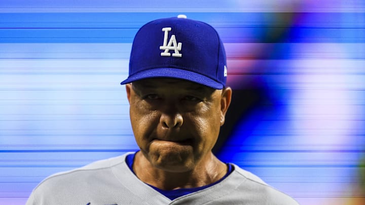 Jul 28, 2025; Cincinnati, Ohio, USA; Los Angeles Dodgers manager Dave Roberts (30) walks off the field during a pitching change in the ninth inning against the Cincinnati Reds at Great American Ball Park. Mandatory Credit: Katie Stratman-Imagn Images