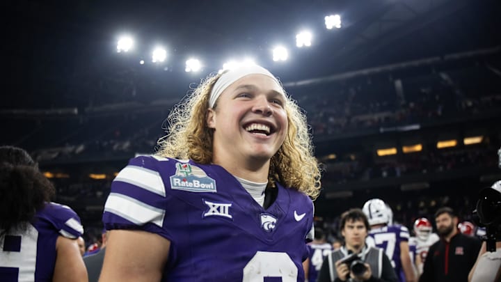 Dec 26, 2024; Phoenix, AZ, USA; Kansas State Wildcats quarterback Avery Johnson (2) celebrates after defeating the Rutgers Scarlet Knights during the Rate Bowl at Chase Field. Mandatory Credit: Mark J. Rebilas-Imagn Images Dec 26, 2024; Phoenix, AZ, USA; Kansas State Wildcats quarterback Avery Johnson (2) celebrates after defeating the Rutgers Scarlet Knights during the Rate Bowl at Chase Field. Mandatory Credit: Mark J. Rebilas-Imagn Images