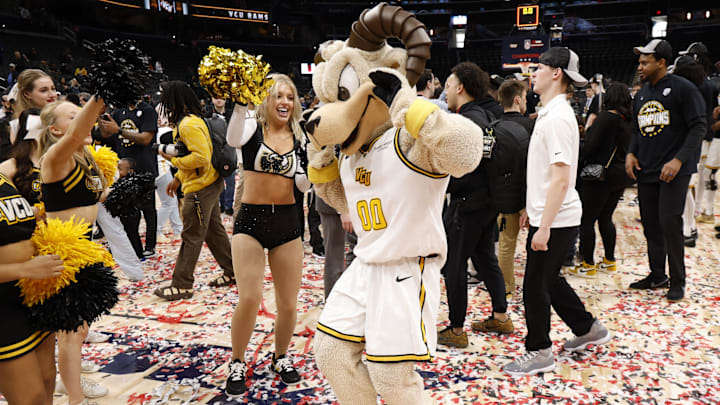 VCU Rams mascot Rodney Ram dances on the court at Capital One Arena.