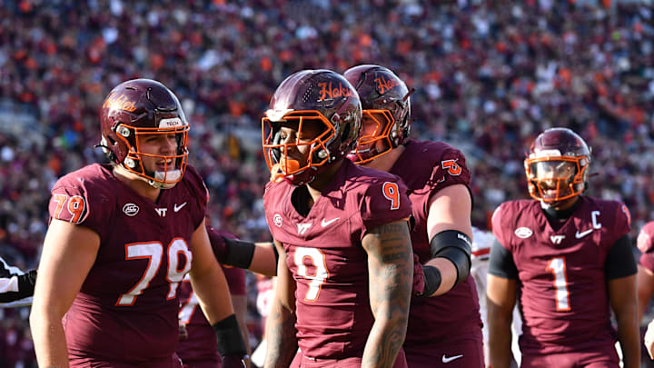 Nov 1, 2025; Blacksburg, Virginia, USA; Virginia Tech Hokies offensive lineman Johnny Garrett (79) celebrates a touchdown by Virginia Tech Hokies wide receiver Cameron Seldon (9) during the second quarter at Lane Stadium. Mandatory Credit: Brian Bishop-Imagn Images