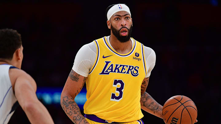 Nov 22, 2023; Los Angeles, California, USA; Los Angeles Lakers forward Anthony Davis (3) controls the ball against the Dallas Mavericks during the second half at Crypto.com Arena. Mandatory Credit: Gary A. Vasquez-Imagn Images