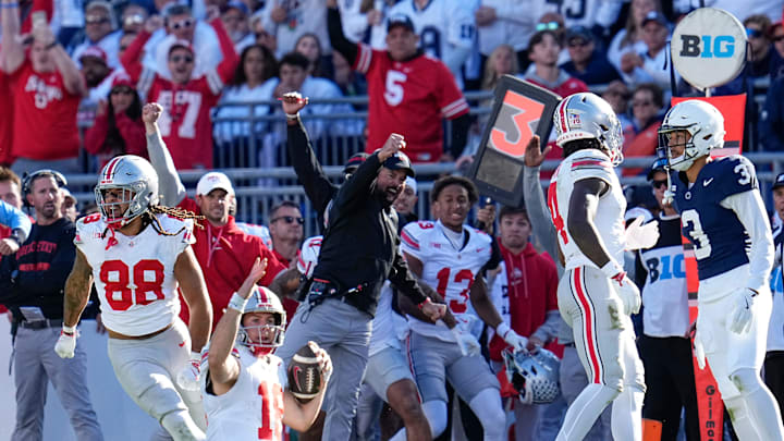 Ohio State Buckeyes quarterback Will Howard (18) and head coach Ryan Day react as Howard slides for a first down late in the second half of the NCAA football game at Beaver Stadium in University Park, Pa. on Saturday, Nov. 2, 2024. Ohio State won 20-13.