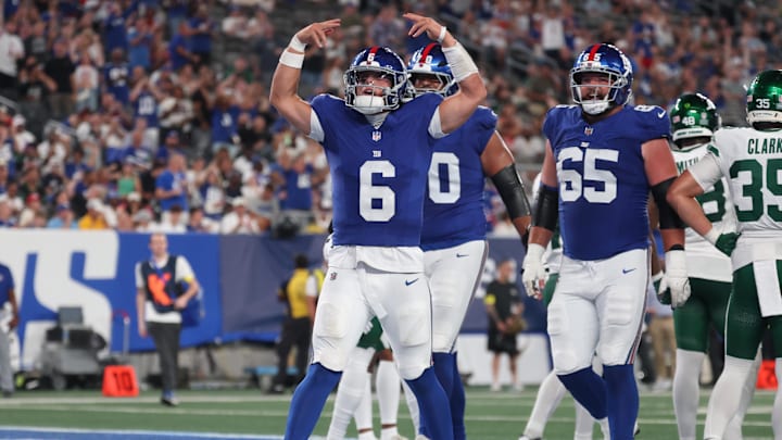 Aug 16, 2025; East Rutherford, New Jersey, USA; New York Giants quarterback Jaxson Dart (6) celebrates his rushing touchdown during the second half against the New York Jets at MetLife Stadium. Mandatory Credit: Vincent Carchietta-Imagn Images