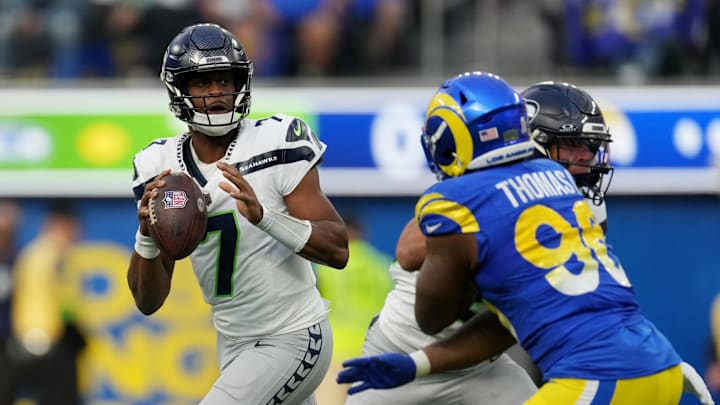 Nov 19, 2023; Inglewood, California, USA; Seattle Seahawks quarterback Geno Smith (7) looks to pass against the Los Angeles Rams in the second quarter at SoFi Stadium. Mandatory Credit: Kirby Lee-Imagn Images