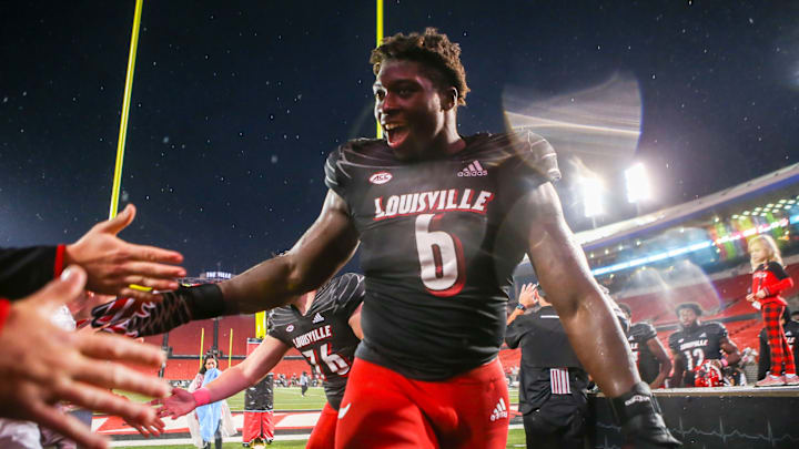 Louisville player Yaya Diaby slapped hands with fans after the Cards win at Cardinal Stadium Saturday. UofL beat Boston College and is now 4-3 and breaks a two-game losing streak. Oct. 23, 2021

Louisville Vs Boston College October 2021