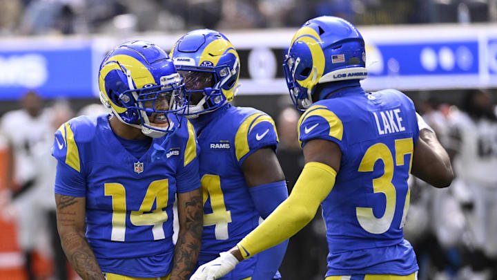 Oct 20, 2024; Inglewood, California, USA; Los Angeles Rams cornerback Cobie Durant (14) celebrates with cornerback Darious Williams (24) and safety Quentin Lake (37) after he breaks up a pass intended for Las Vegas Raiders tight end Brock Bowers at SoFi Stadium. Mandatory Credit: Alex Gallardo-Imagn Images Oct 20, 2024; Inglewood, California, USA; Los Angeles Rams cornerback Cobie Durant (14) celebrates with cornerback Darious Williams (24) and safety Quentin Lake (37) after he breaks up a pass intended for Las Vegas Raiders tight end Brock Bowers at SoFi Stadium. Mandatory Credit: Alex Gallardo-Imagn Images