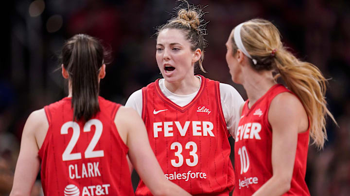 Indiana Fever forward Katie Lou Samuelson (33) yells in excitement with Indiana Fever guard Caitlin Clark (22) and Indiana Fever guard Lexie Hull (10) on Thursday, June 13, 2024, during the game at Gainbridge Fieldhouse in Indianapolis. The Indiana Fever defeated the Atlanta Dream, 91-84.