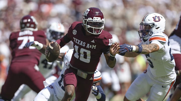 Sep 27, 2025; College Station, Texas, USA; Texas A&M Aggies quarterback Marcel Reed (10) runs with the ball as Auburn Tigers safety Eric Winters (25) attempts to make a tackle during the first quarter at Kyle Field. Mandatory Credit: Troy Taormina-Imagn Images Sep 27, 2025; College Station, Texas, USA; Texas A&M Aggies quarterback Marcel Reed (10) runs with the ball as Auburn Tigers safety Eric Winters (25) attempts to make a tackle during the first quarter at Kyle Field. Mandatory Credit: Troy Taormina-Imagn Images
