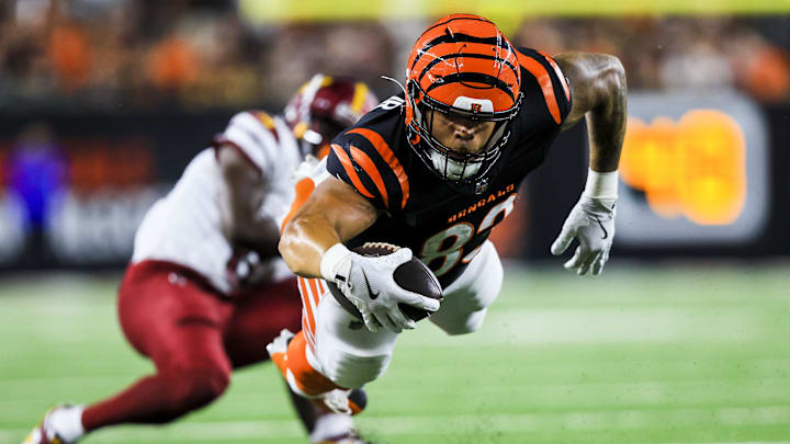 Sep 23, 2024; Cincinnati, Ohio, USA; Cincinnati Bengals tight end Erick All Jr. (83) advances the ball against the Washington Commanders in the first half at Paycor Stadium. Mandatory Credit: Katie Stratman-Imagn Images
