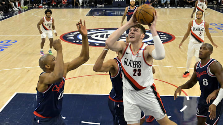 Oct 30, 2024; Inglewood, California, USA;  Los Angeles Clippers forward Nicolas Batum (33) defends a shot by Portland Trail Blazers center Donovan Clingan (23) in the second half at Intuit Dome. Mandatory Credit: Jayne Kamin-Oncea-Imagn Images
