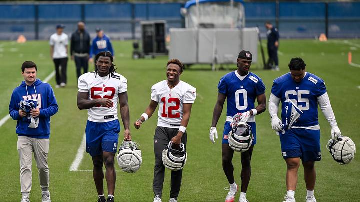 New York Giants rookies Arvell Reese (52), Colton Hood (12), Malachi Fields (0) and Francis Mauigoa (65) walk off the field. New York Giants rookies Arvell Reese (52), Colton Hood (12), Malachi Fields (0) and Francis Mauigoa (65) walk off the field.