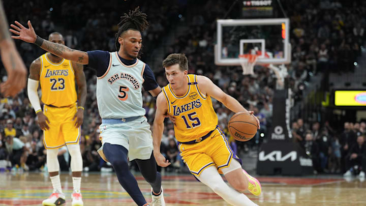 Nov 27, 2024; San Antonio, Texas, USA; Los Angeles Lakers guard Austin Reaves (15) dribbles past San Antonio Spurs guard Stephon Castle (5) in the second half at Frost Bank Center. Mandatory Credit: Daniel Dunn-Imagn Images Nov 27, 2024; San Antonio, Texas, USA; Los Angeles Lakers guard Austin Reaves (15) dribbles past San Antonio Spurs guard Stephon Castle (5) in the second half at Frost Bank Center. Mandatory Credit: Daniel Dunn-Imagn Images