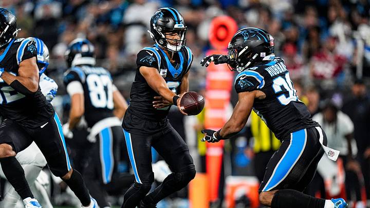 Carolina Panthers quarterback Bryce Young (9) hands the ball to running back Chuba Hubbard Carolina Panthers quarterback Bryce Young (9) hands the ball to running back Chuba Hubbard