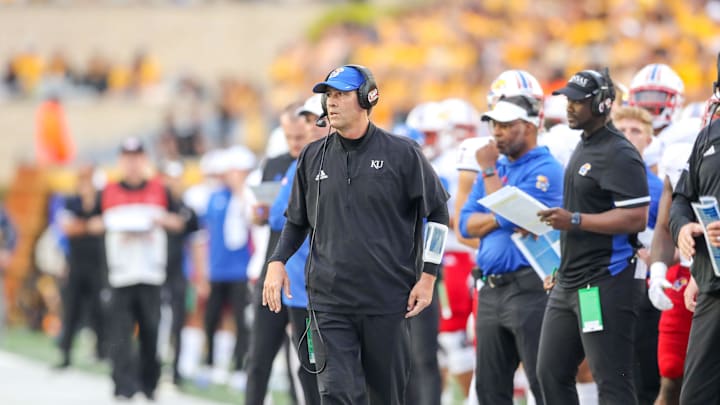 Sep 10, 2022; Morgantown, West Virginia, USA; Kansas Jayhawks quarterbacks coach Jim Zebrowski walks along the sidelines during the second quarter against the West Virginia Mountaineers at Mountaineer Field at Milan Puskar Stadium. Mandatory Credit: Ben Queen-Imagn Images