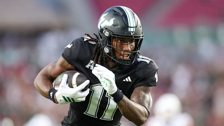 Aug 28, 2025; Tampa, Florida, USA; South Florida Bulls wide receiver Keshaun Singleton (11) runs into the end zone for a touchdown against the Boise State Broncos in the third quarter against the Boise State Broncos in the third quarter at Raymond James Stadium. Mandatory Credit: Nathan Ray Seebeck-Imagn Images