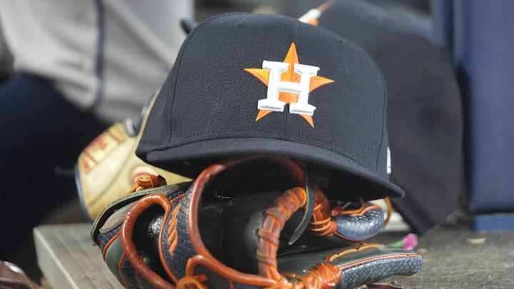 Sep 10, 2025; Toronto, Ontario, CAN; A detail view of a Houston Astros hat and ball glove in the dug out during a game against the Toronto Blue Jays at Rogers Centre. 