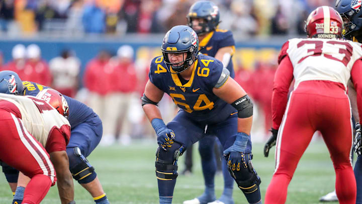 Nov 12, 2022; Morgantown, West Virginia, USA; West Virginia Mountaineers offensive lineman Wyatt Milum (64) during the third quarter against the Oklahoma Sooners at Mountaineer Field at Milan Puskar Stadium. Mandatory Credit: Ben Queen-Imagn Images
