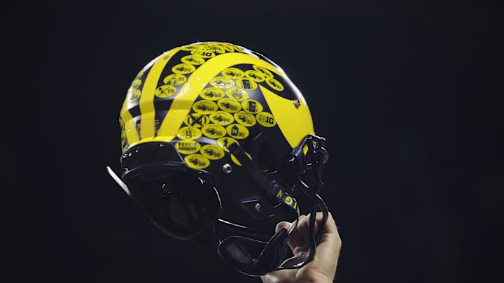 A Michigan Wolverines player holds their helmet Mandatory Credit: Trevor Ruszkowski-Imagn Images