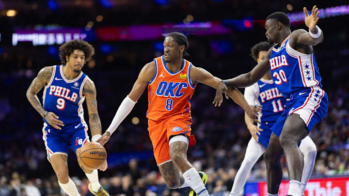 Jan 14, 2025; Philadelphia, Pennsylvania, USA; Oklahoma City Thunder forward Jalen Williams (8) dribbles the ball against Philadelphia 76ers center Adem Bona (30) and guard Kelly Oubre Jr. (9) during the third quarter at Wells Fargo Center. Mandatory Credit: Bill Streicher-Imagn Images Jan 14, 2025; Philadelphia, Pennsylvania, USA; Oklahoma City Thunder forward Jalen Williams (8) dribbles the ball against Philadelphia 76ers center Adem Bona (30) and guard Kelly Oubre Jr. (9) during the third quarter at Wells Fargo Center. Mandatory Credit: Bill Streicher-Imagn Images