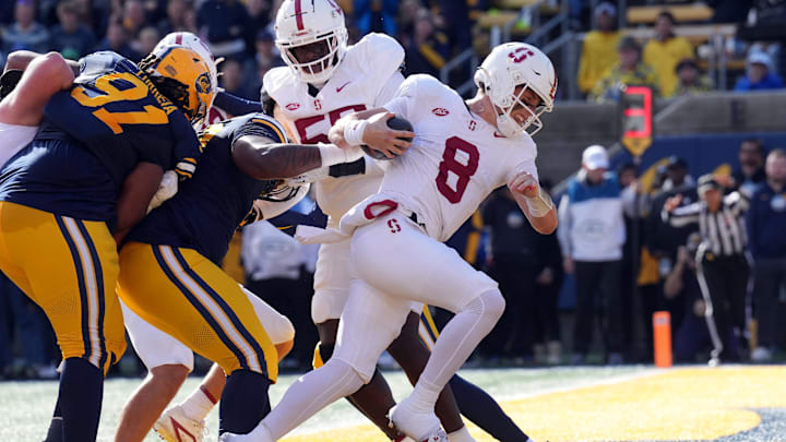 Nov 23, 2024; Berkeley, California, USA; Stanford Cardinal quarterback Justin Lamson (8) rushes for a touchdown against the California Golden Bears during the first quarter at California Memorial Stadium. Mandatory Credit: Darren Yamashita-Imagn Images