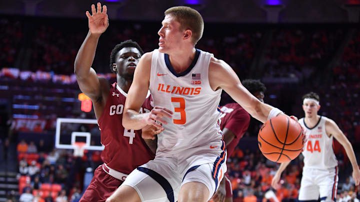 Nov 14, 2025; Champaign, Illinois, USA;  Illinois Fighting Illini forward Ben Humrichhous (3) drives to the basket as Colgate Raiders guard Josh Ahayere (4) pursues during the first half at State Farm Center. Mandatory Credit: Ron Johnson-Imagn Images