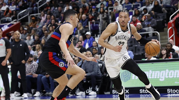 Mar 1, 2025; Detroit, Michigan, USA;  Brooklyn Nets forward Jalen Wilson (22) dribbles defended by Detroit Pistons forward Simone Fontecchio (19) at Little Caesars Arena. Mandatory Credit: Rick Osentoski-Imagn Images