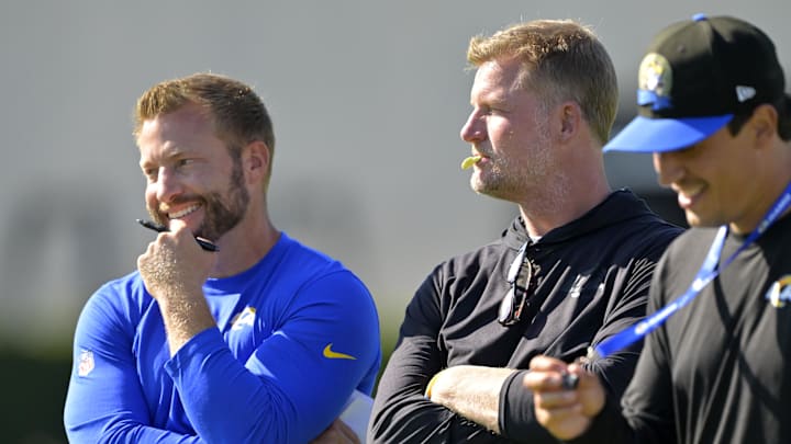 Jul 29, 2024; Los Angeles, CA, USA; Los Angeles Rams head coach Sean McVay, general manager Les Snead and chief of staff Carter Crutchfield talk on the field during training camp at Loyola Marymount University. Mandatory Credit: Jayne Kamin-Oncea-Imagn Images