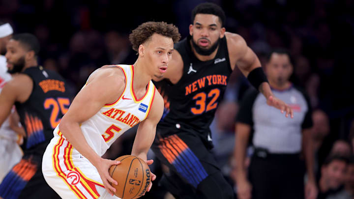 Apr 20, 2026; New York, New York, USA; Atlanta Hawks guard Dyson Daniels (5) looks to pass the ball against New York Knicks center Karl-Anthony Towns (32) during the first quarter of game two of the first round of the 2026 NBA Playoffs at Madison Square Garden. Mandatory Credit: Brad Penner-Imagn Images